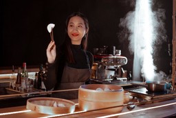 asian-girl-cooking-dumpling-in-kitchenasian-girl-cooking-dumpling-in-kitchen